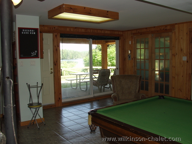 Cottage basement recreation room looking toward Malone Bay,
       Lac des trente et un milles (31 miles lake),
       Bouchette, Quebec
