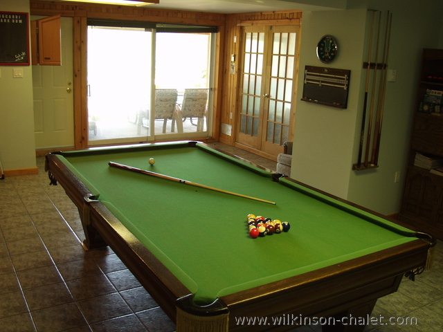 Pool table in cottage basement recreation room